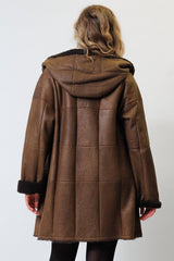 Damen Christ Winter Lammfellmantel aus Curlylamm braun mit Kapuze federleicht