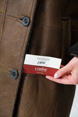 Damen Christ Winter Lammfellmantel aus Curlylamm braun mit Kapuze federleicht