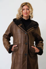 Damen Christ Winter Lammfellmantel aus Curlylamm braun mit Kapuze federleicht