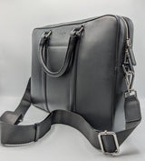 Schwarze, moderne Laptoptasche aus Rindleder mit Griffe und Trageriemen