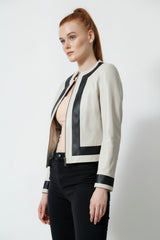 Damen Bolero in Ziegennappa ivory mit Kontrast schwarz perforiert