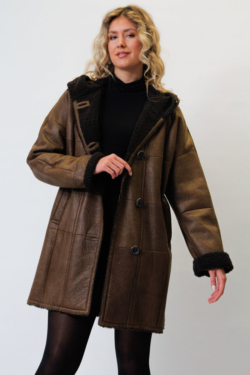 Damen Christ Winter Lammfellmantel aus Curlylamm braun mit Kapuze federleicht